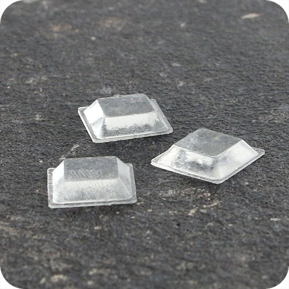 Lipnūs silikono kalneliai Bumpons 10 x 10 x 2,5mm, savilipiai, skaidrūs, trapecijos formos  (350vnt.)
